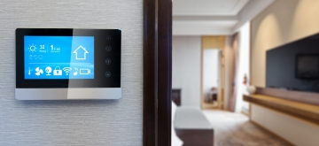 A smart thermostat is set for the summer.