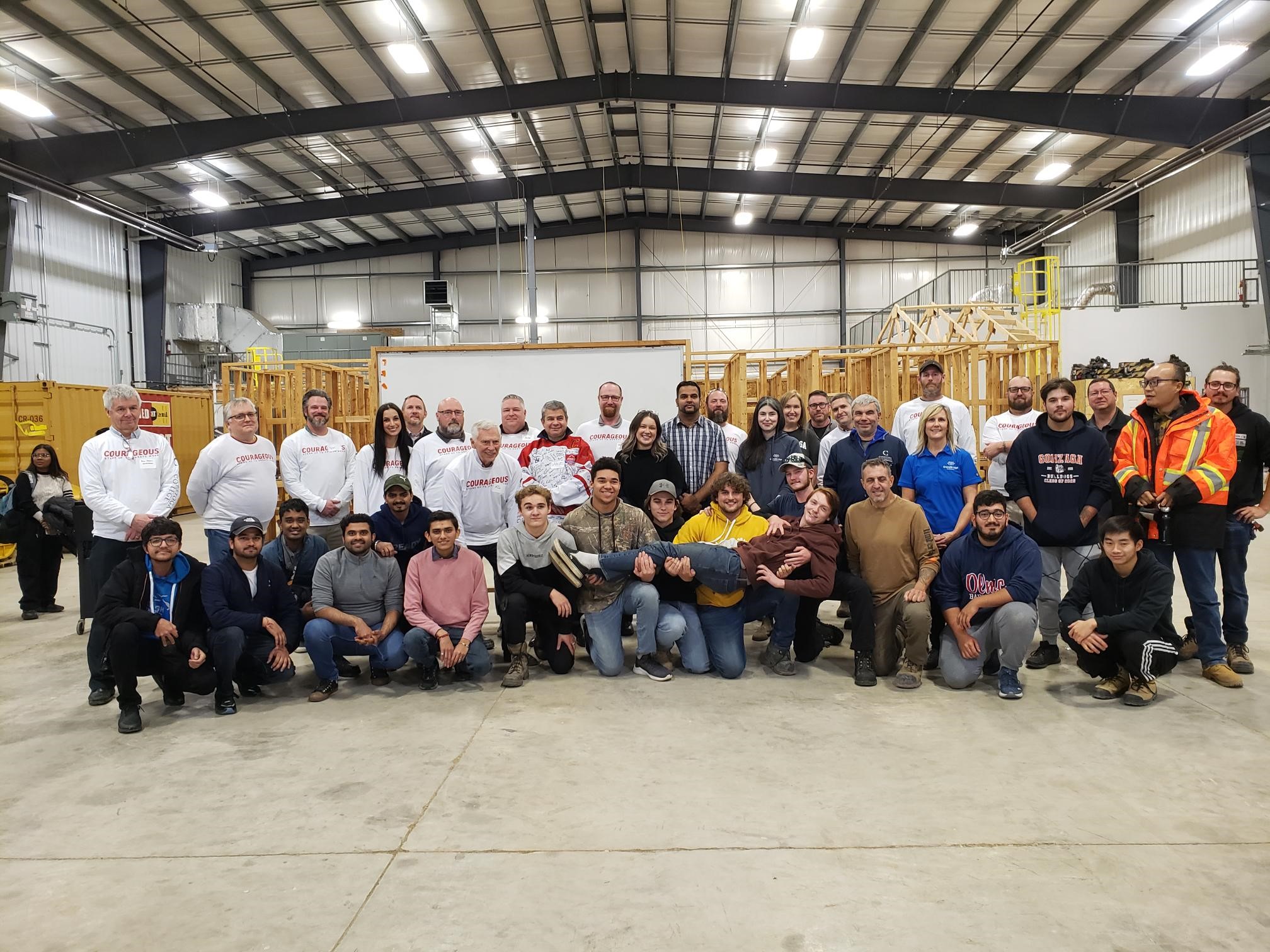 Group photo or people in a warehouse