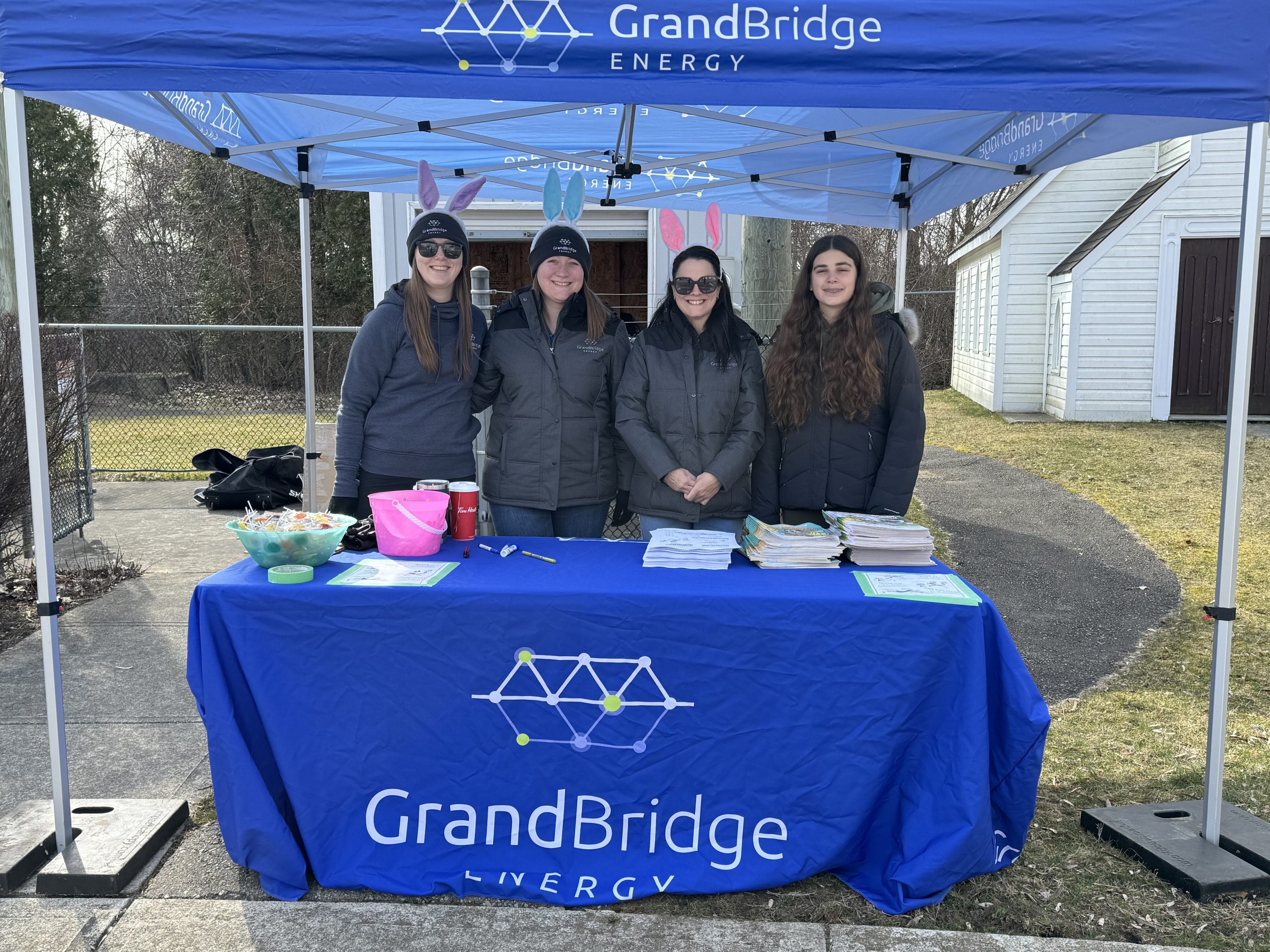 GrandBridge Energy team running a booth at an event