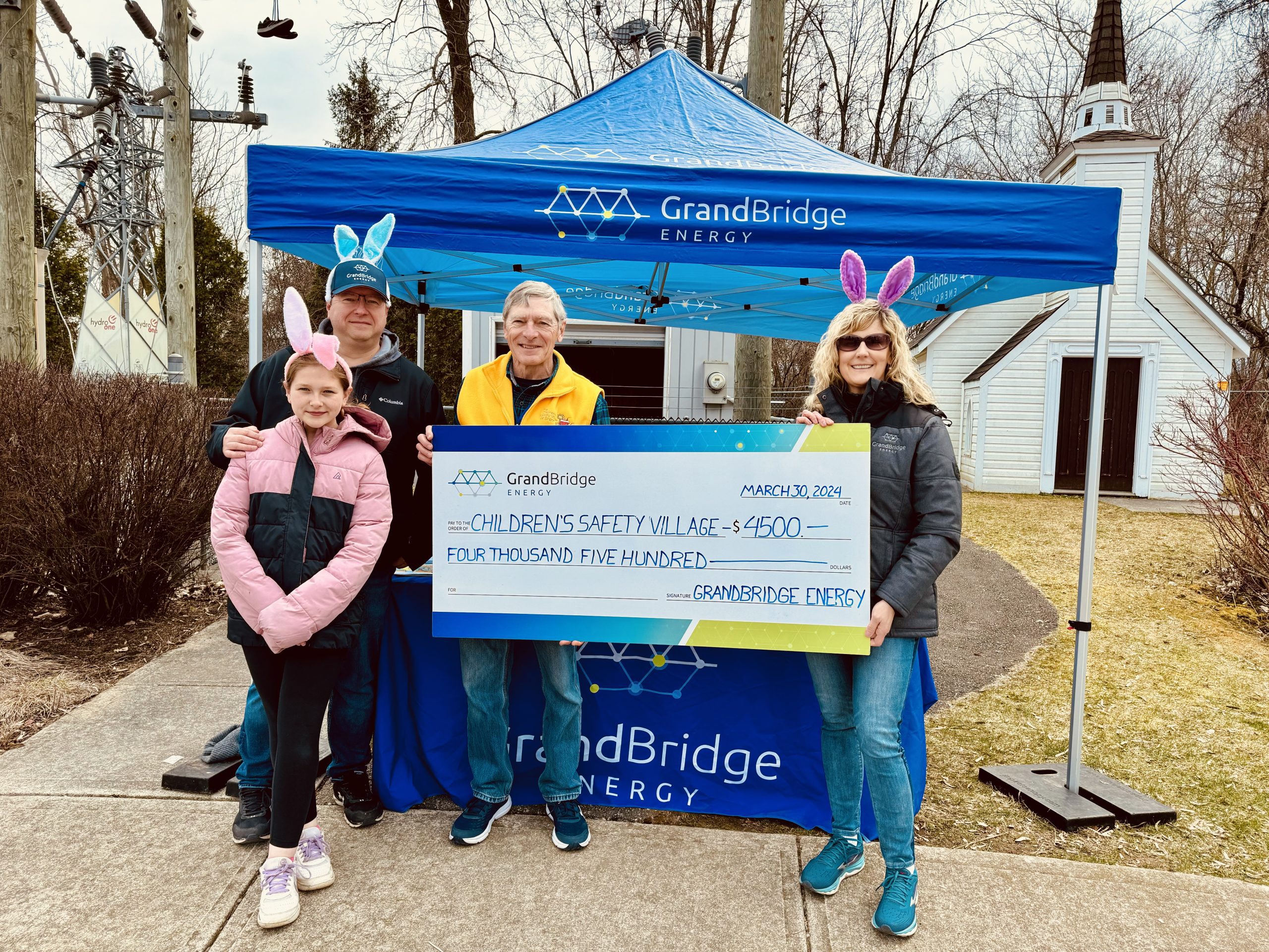 The GrandBridge Energy team makes a donation to the Children's Safety Village.