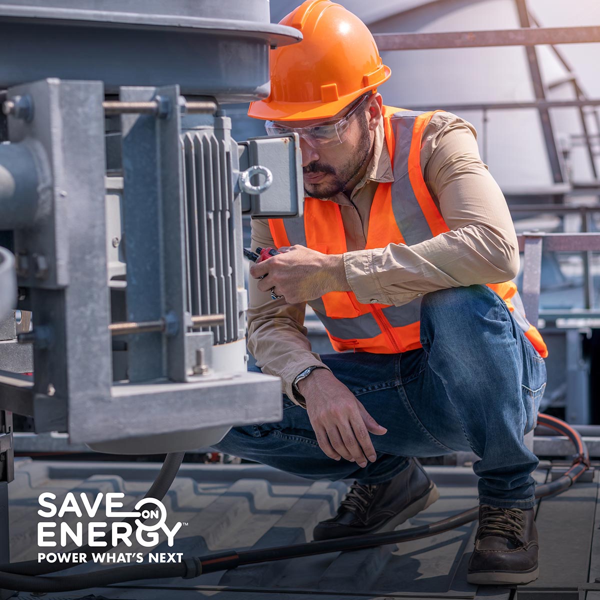 Man works on HVAC equipment on a roof top