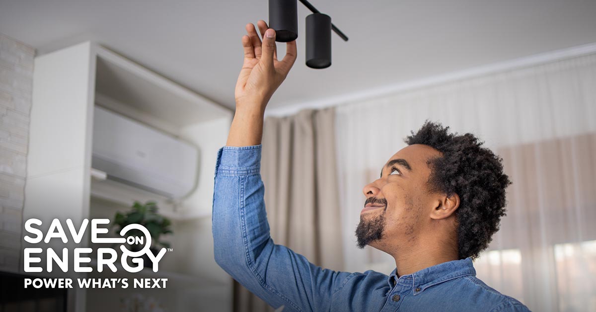 Man installs LED light.