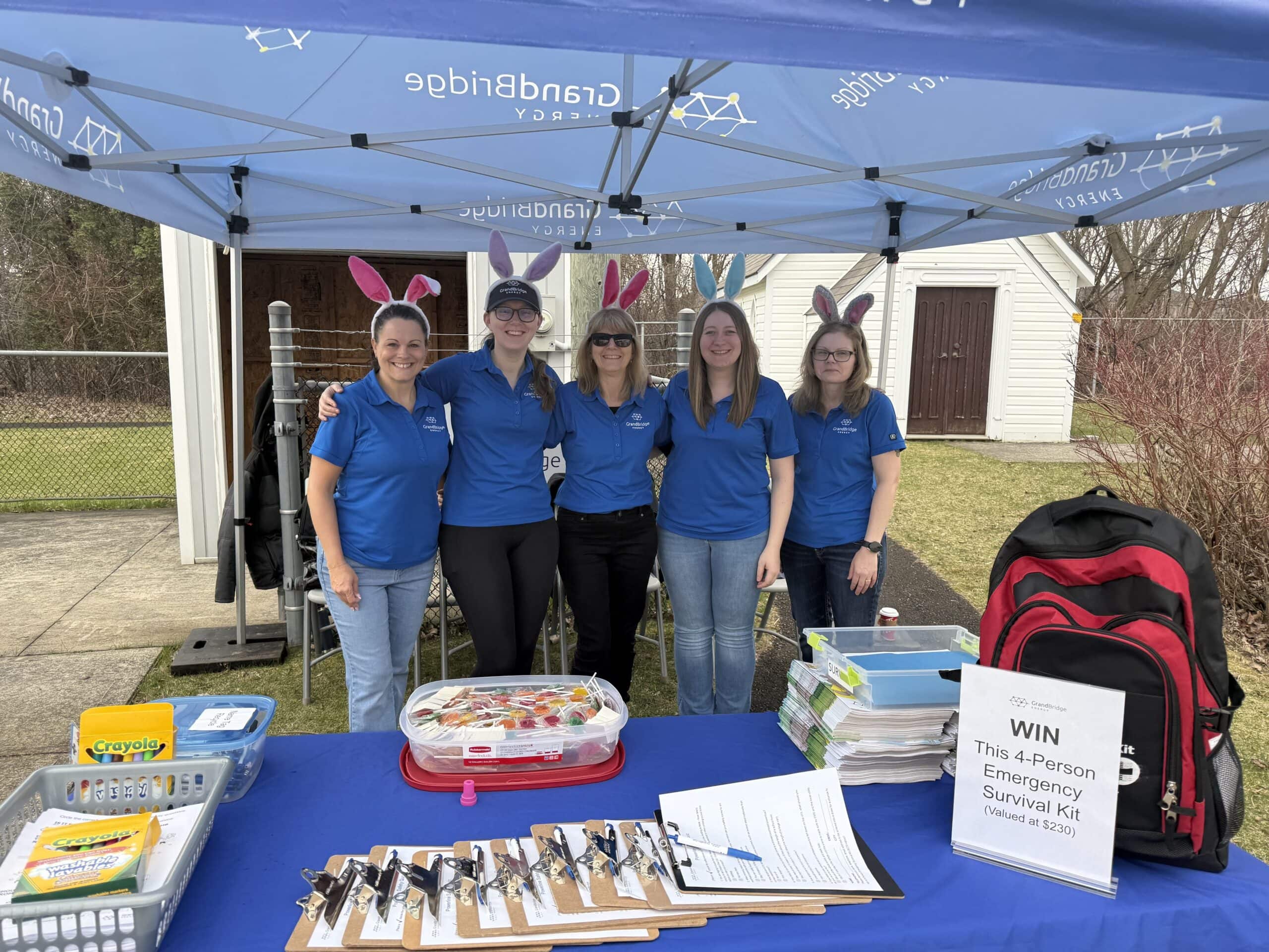 Four employees at the Children's Safety Village for their annual Easter Egg hunt.