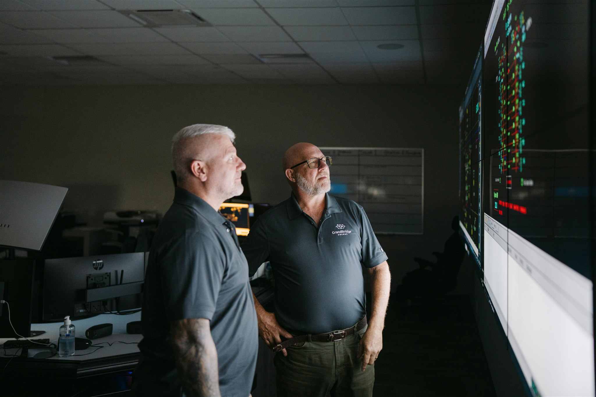 two professionals looking at an electronic chart at Grandbridge facility
